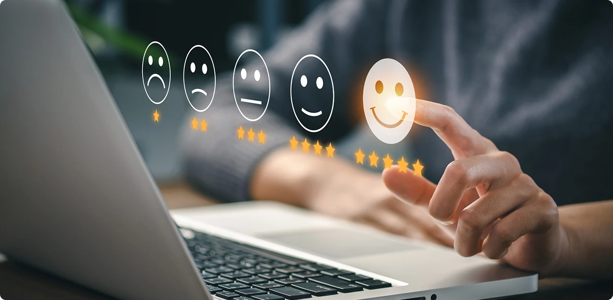 Customer satisfaction rating with five-star feedback on a laptop